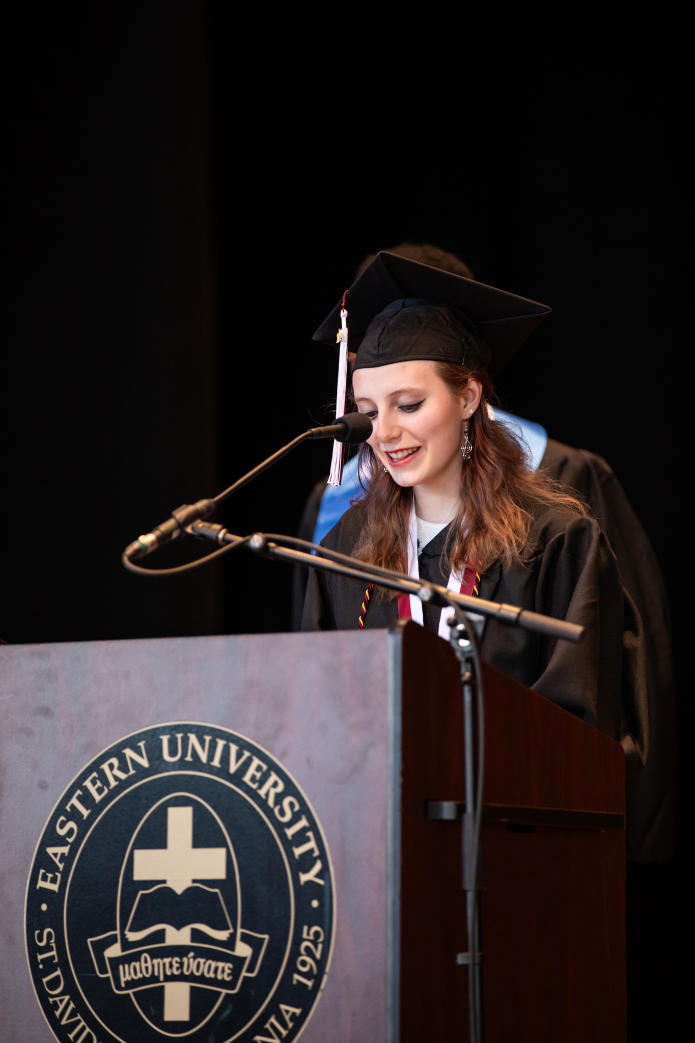 Aleah Zubrod reads a Scripture passage at gradutaion
